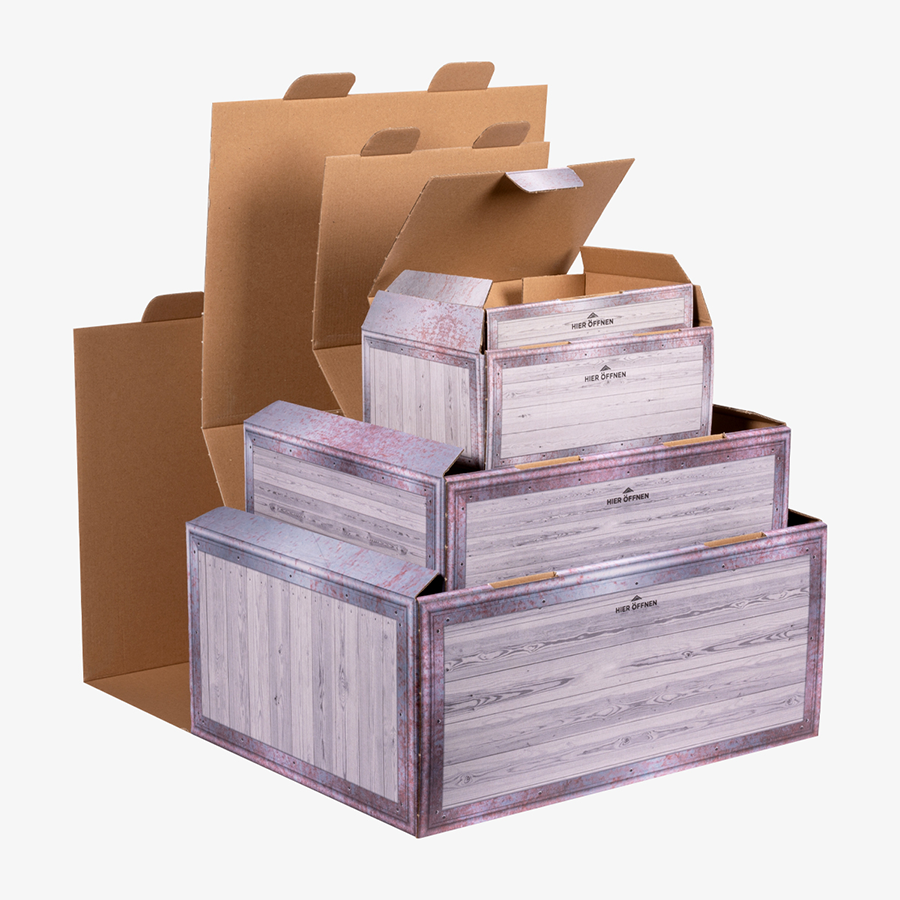 Klappdeckelkarton-Musterset: vier geöffnete Kartons in mehreren Größen im neutralen Design