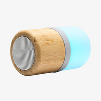 Bluetooth-Lautsprecher aus Bambus mit 4 LED-Beleuchtungsstufen eingeschaltet leuchtend liegend