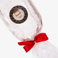 Confiserie-Stollen (alkoholhaltig), Verschluss verziert mit roter Schleife