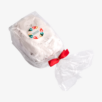 Confiserie-Stollen (alkoholhaltig), verpackt im OPP Folienbeutel, verziert mit roter Schleife