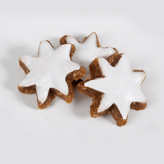 Zimtstern, liegend, mit Zuckerguss